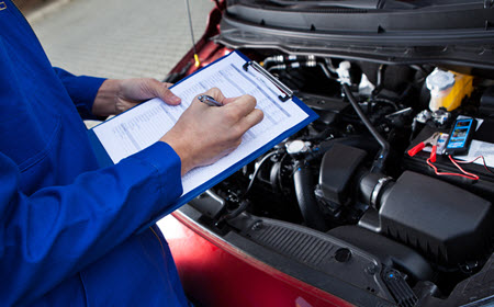 Mechanic Checking Mercedes-Benz